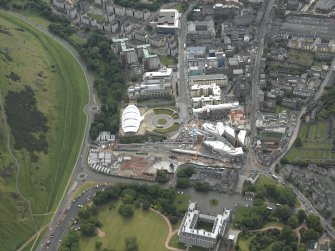 Oblique aerial view centred on the construction of the Scottish Parliament with the exhibition centre and palace adjacent, taken from the NE.