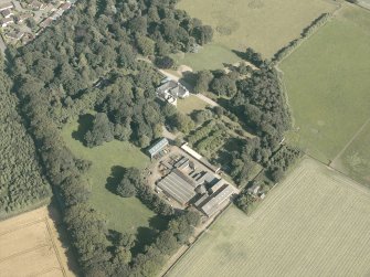 Oblique aerial view of the country house and farmsteading, taken from the NW.