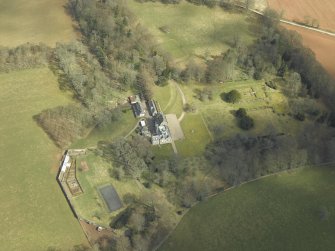 Oblique aerial view centred on the country house and gardens, taken from the WSW.