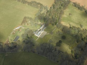 Oblique aerial view centred on the country house and gardens, taken from the SW.