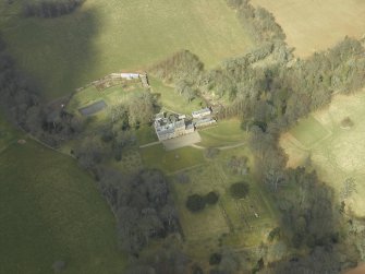 Oblique aerial view centred on the country house and gardens, taken from the SSE.