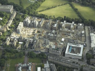 Oblique aerial view centred on the redevelopment of the hospital for housing, taken from the NNW.
