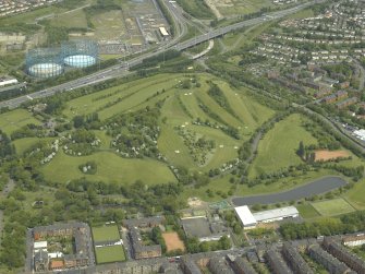 General oblique aerial view of the park and golf course with the gasworks adjacent, taken from the S.