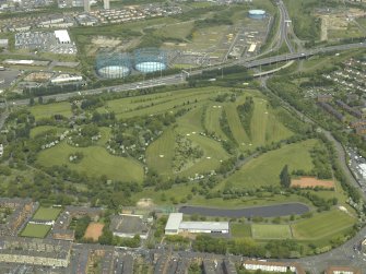 General oblique aerial view of the park and golf course with the gasworks adjacent, taken from the S.