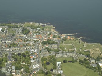 General oblique aerial view of the town centred on the remains of the cathedral and castle, taken from the S.