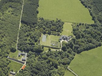 Oblique aerial view centred on the house, taken from the NNW.
