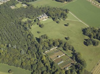 General oblique aerial view centred on the country house and walled garden, taken from the SW.