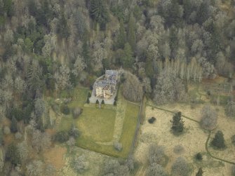 Oblique aerial view centred on the tower-house, taken from the SE.