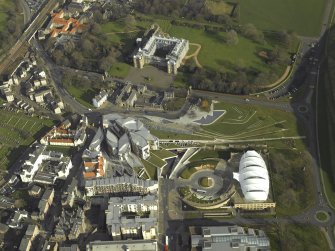 Oblique aerial view centred on Holyrood Palace, Abbey, new Parliament building and 'Our Dynamic Earth', taken from the WSW.