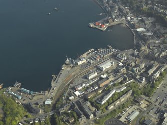 General oblique aerial view of the town centred on the railway station, taken from the S.