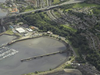 Oblique aerial view centred on the former Royal Naval Base, taken from the NW.