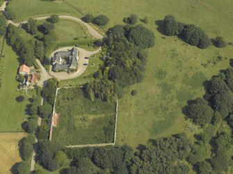 Oblique aerial view centred on the coach house and walled garden, taken from the WSW.
