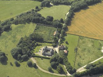 Oblique aerial view centred on the coach house and walled garden, taken from the NE.