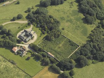Oblique aerial view centred on the coach house and walled garden, taken from the NW.