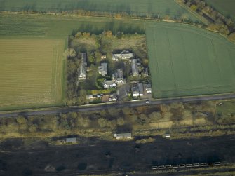 General oblique aerial view centred on the house and hospital buildings, taken from the S.