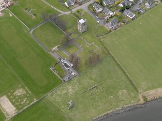 Oblique aerial view centred on the remains of the Abbey, taken from the SE.