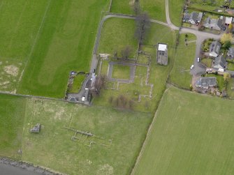 Oblique aerial view centred on the remains of the Abbey, taken from the E.