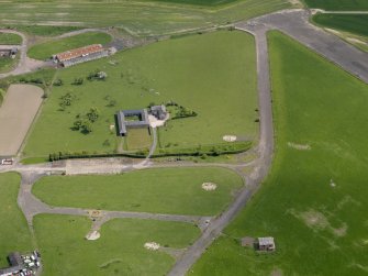 Oblique aerial view centred on Muirhouses farmsteading with the control tower and dispersal area adjacent, taken from the NNW.