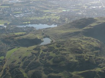 General oblique aerial view of the cultivation terraces and the remains of the fort on Arthur's Seat and Dunsapie, taken from the NE.