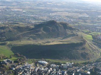 General oblique aerial view looking across Salisbury Crags towards Arthur's Seat, taken from the NW.