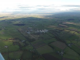 General oblique aerial view centred on the airfield with the Nuclear Power Station adjacent, taken from the SW.