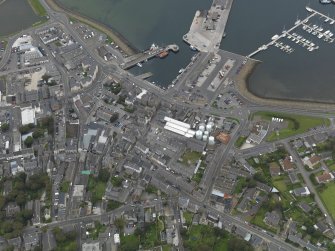Oblique aerial view centred on the harbour area, taken from the SE.