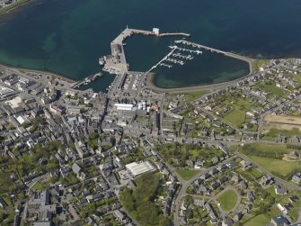 General oblique aerial view centred on Kirkwall Harbour, taken from the SE.