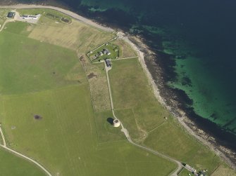 Oblique aerial view centred on the Martello Tower at Hackness with the gun battery adjacent, taken from the S.