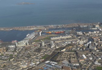 General oblique aerial view centred on the docks, taken from the SW.
