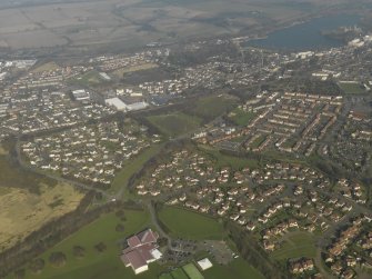 General oblique aerial view centred on the town, taken from the SW.