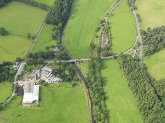 General oblique aerial view centred on the bridges, taken from the SE.