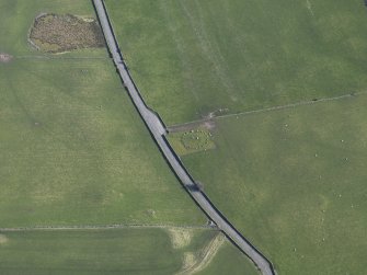 Oblique aerial view centred on Torhousekie stone circle, taken from the NNW.