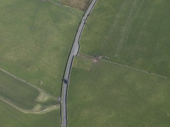 Oblique aerial view centred on Torhousekie stone circle, taken from the WNW.