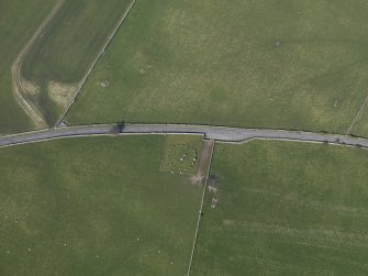 Oblique aerial view centred on Torhousekie stone circle, taken from the SSW.
