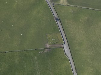 Oblique aerial view centred on Torhousekie stone circle, taken from the SE.