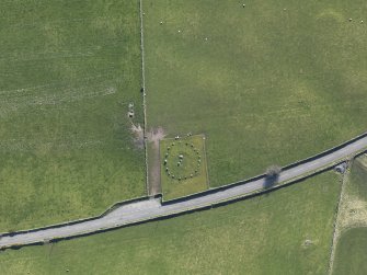 Oblique aerial view centred on Torhousekie stone circle, taken from the NE.
