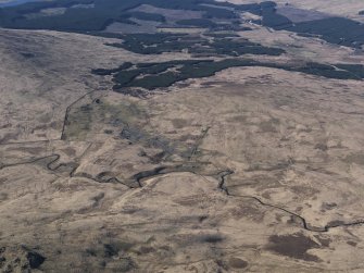 General oblique aerial view centred on the remains of the Woodhead lead mine, taken from the S.
