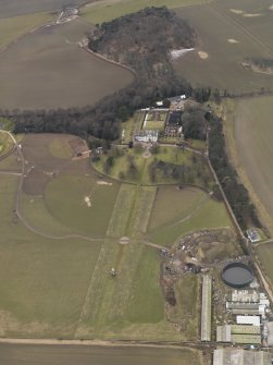 General oblique aerial view centred on the country house, taken from the ENE.