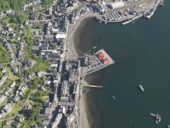 General oblique aerial view of Oban centred on the pier, taken from the N.