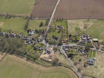 Oblique aerial view centred on the village taken from the NW.