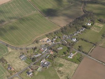 Oblique aerial view centred on the village taken from the SW.