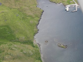 Oblique aerial view of the broch at West Burra Firth, looking S.
