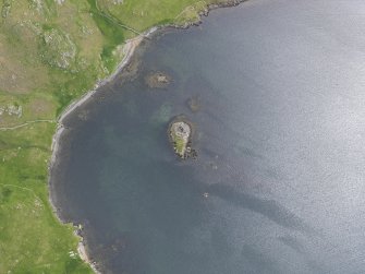 Oblique aerial view of the broch at West Burra Firth, looking SE.