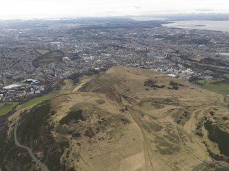 General oblique aerial view of the city and the park centred on Arthur's Seat, taken from the ESE.