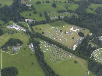 General oblique aerial view of Blair Castle policies and the agricultural fair, looking to the NNE.