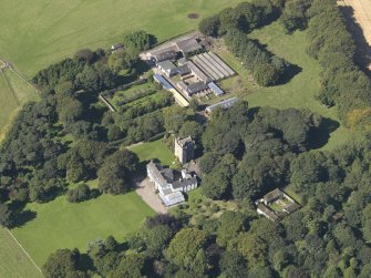 General oblique aerial view of the Affleck Estate, centred on the castle, taken from the SE.