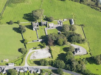 Oblique aerial view of Dundrennan Abbey, taken from the WNW.