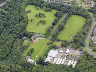 Oblique aerial view of Kinneil House and Duchess Anne Cottages, Bo'ness, taken from the SW.