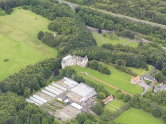 Oblique aerial view of Kinneil House and Duchess Anne Cottages, Bo'ness, taken from the ESE.