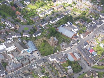 Oblique aerial view of Lockerbie, centred on Dryfesdale Parish Church, taken from the ESE.